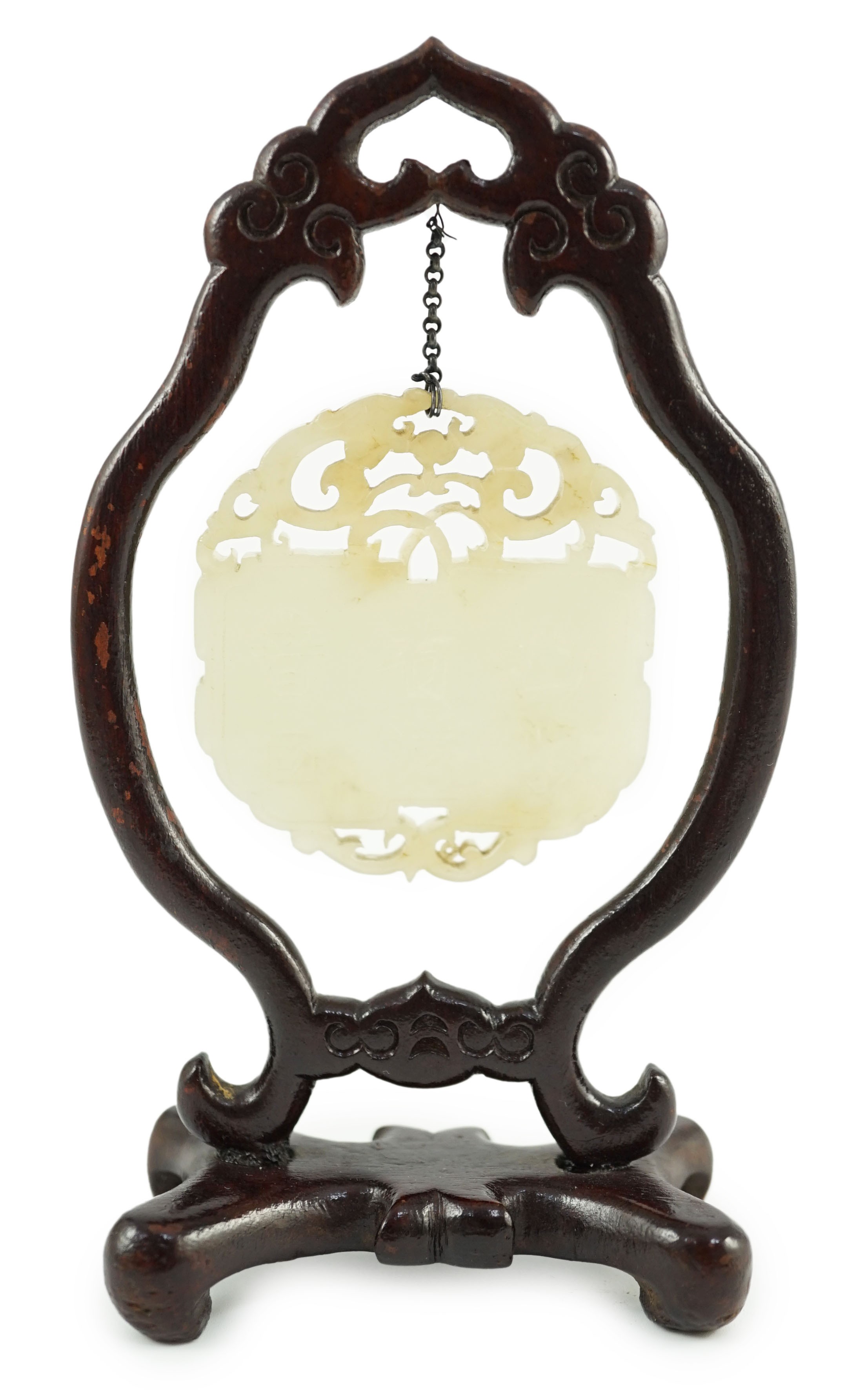 A Chinese pale celadon jade inscribed plaque, 19th/20th century, 5.1cm, suspended from a wood stand